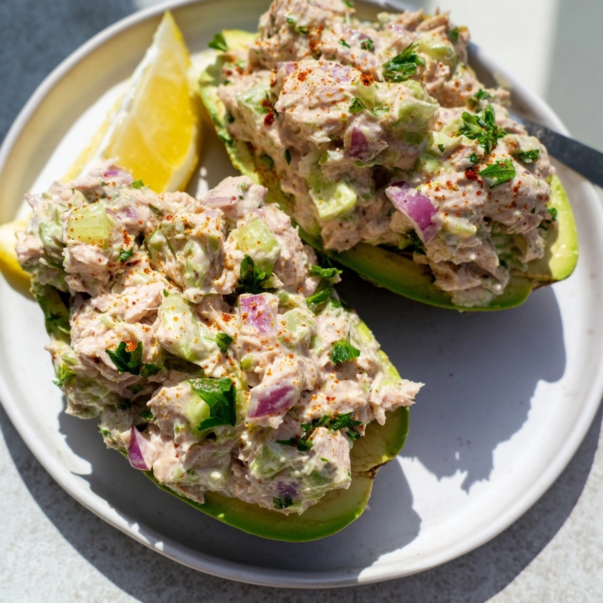 Luscious Avocado Tuna Salad Boats recipe bursting, a fresh, gluten-free lunch idea.