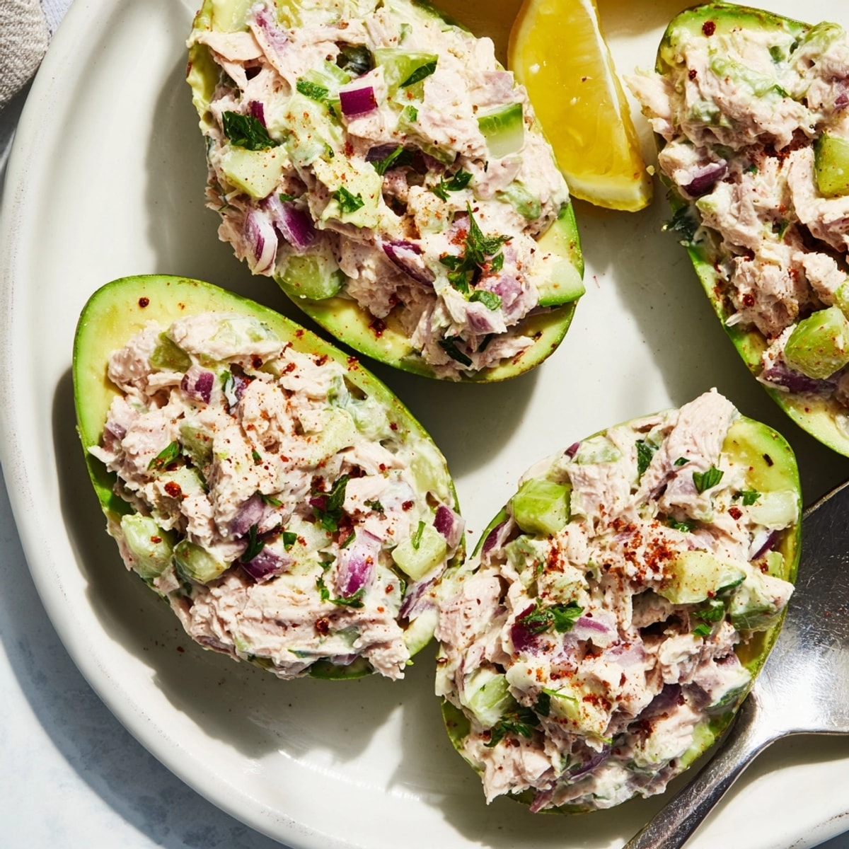 Bright, savory Avocado Tuna Salad Boats, a colorful photo illustrating simple prep.