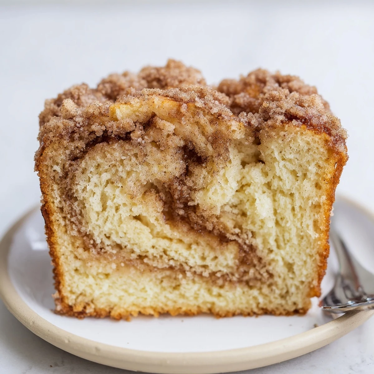 Moist Cinnamon Sugar Maple Bourbon Pancake Muffin Loaf with a crunchy topping.  