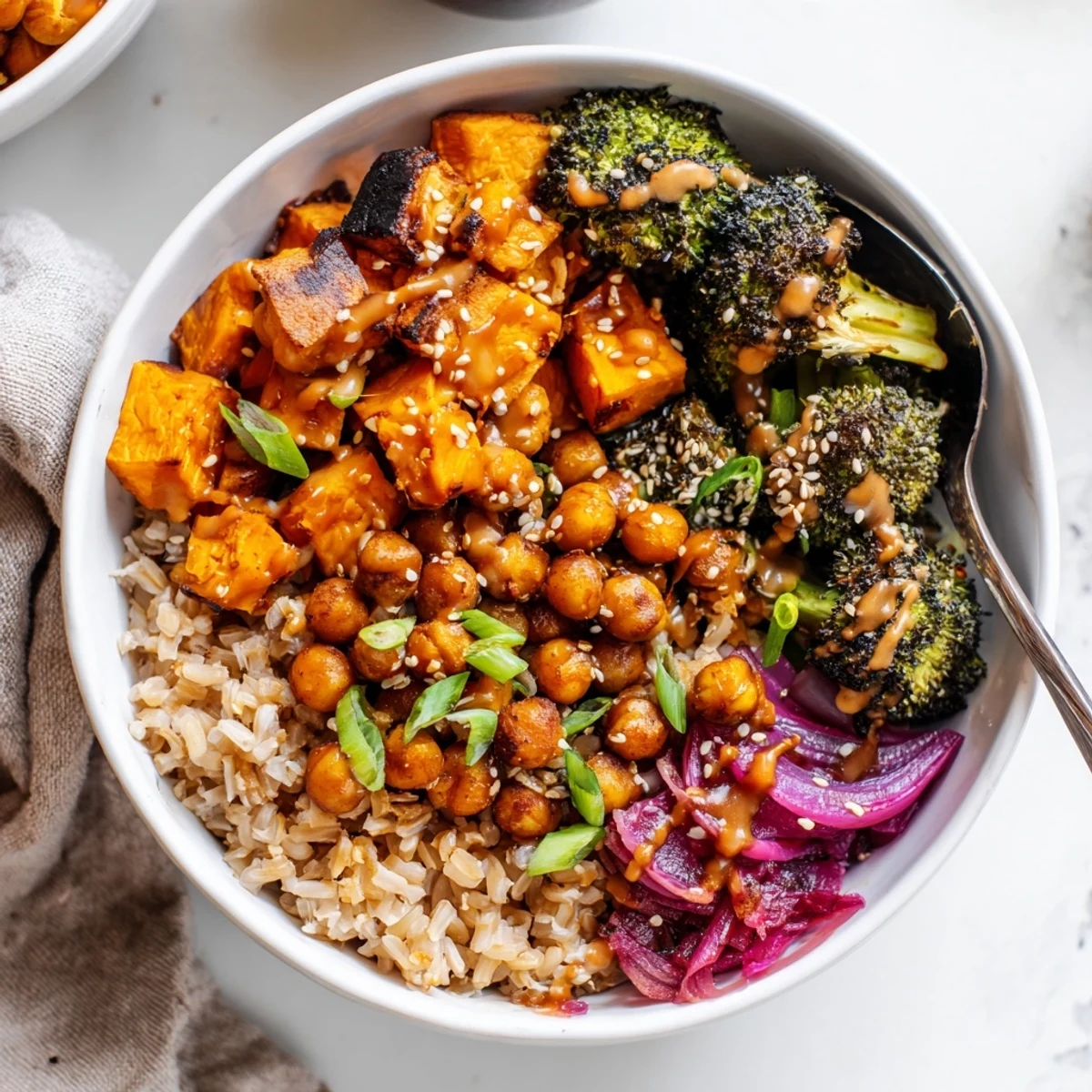 Customized Bold Sauce Drizzle Bowls with quinoa, sweet potatoes, and zesty sauces.