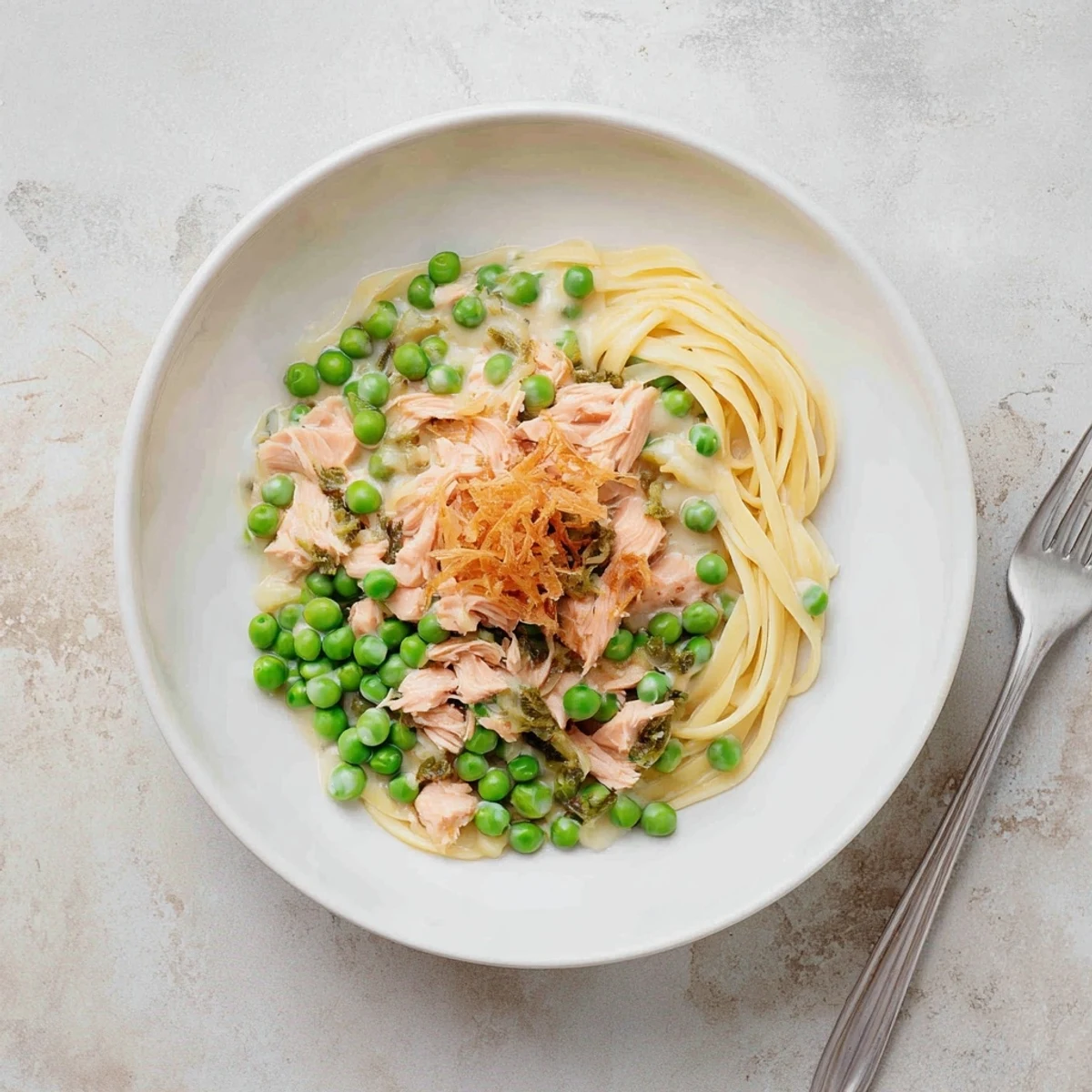 Golden-brown homemade Tuna Noodle Casserole with a crispy onion topping, ready to serve and enjoy.