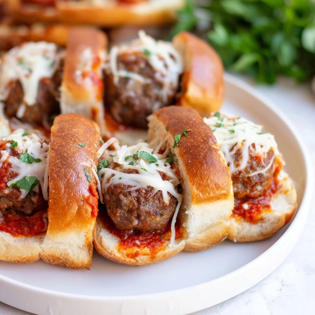 Close-up of bubbling Easy Christmas Meatball Sliders with marinara, showcasing flavorful holiday comfort food.