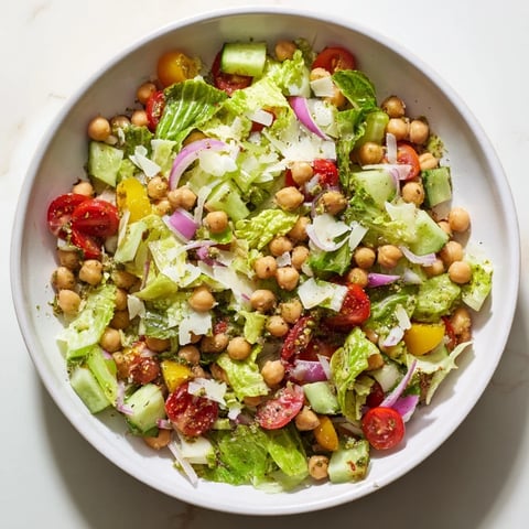 Bright, colorful La Scala Chopped Chickpea Salad, showcasing crisp vegetables and creamy chickpeas in a bowl ready to enjoy.