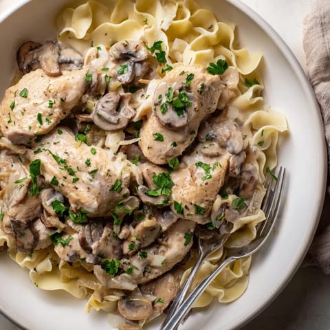 A comforting Creamy Chicken Stroganoff with tender chicken and savory mushrooms, perfect for dinner.  