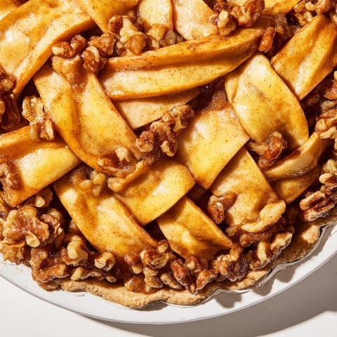 Perfectly baked Lattice Orchard shows off a stunning apple lattice over a walnut and honey filling.