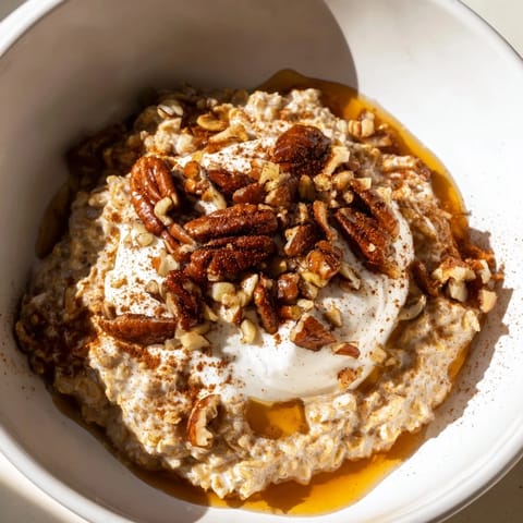 Steaming bowl of Pumpkin Spice Latte Oats, perfect for a cozy fall morning enjoyment.