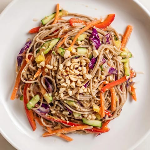 Chilled cold noodle salad, tossed with sesame-ginger dressing, ready for a flavorful, light meal.