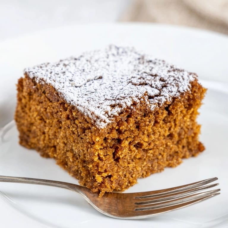 Enjoy freshly baked Cinnamon Gingerbread Snack Cake: a simple, comforting spiced loaf for any occasion.