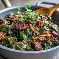 Classic Southern collard greens simmered with smoked turkey and sweet onions, a hearty soul food side bursting with smoky flavor.